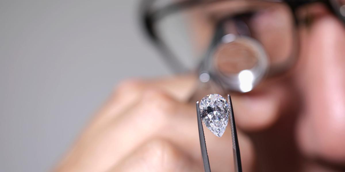 Picture of Jeweller inspecting a diamond
