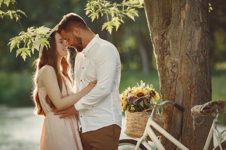 Couple embracing in a park in summer