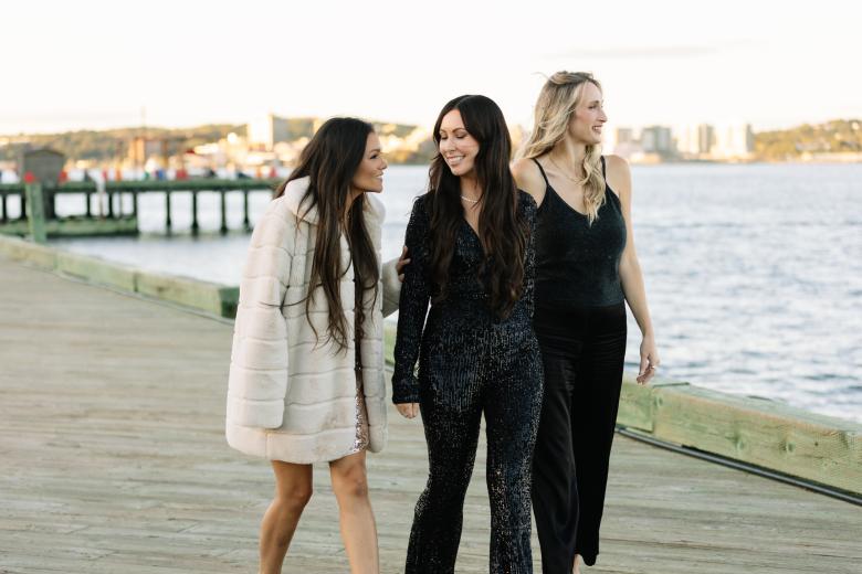 young women walking on boardwalk wearing Bella Moda jewellery